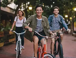 group of diverse young adults on bikes